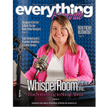 A female broadcaster smiling behind a microphone on the cover of Everything Knoxville magazine
