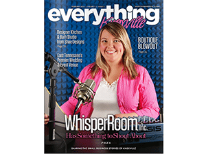 A female broadcaster smiling behind a microphone on the cover of Everything Knoxville magazine