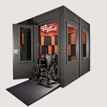 An 8'x8' WhisperRoom sound isolation booth with a wheelchair ramp and ADA package
