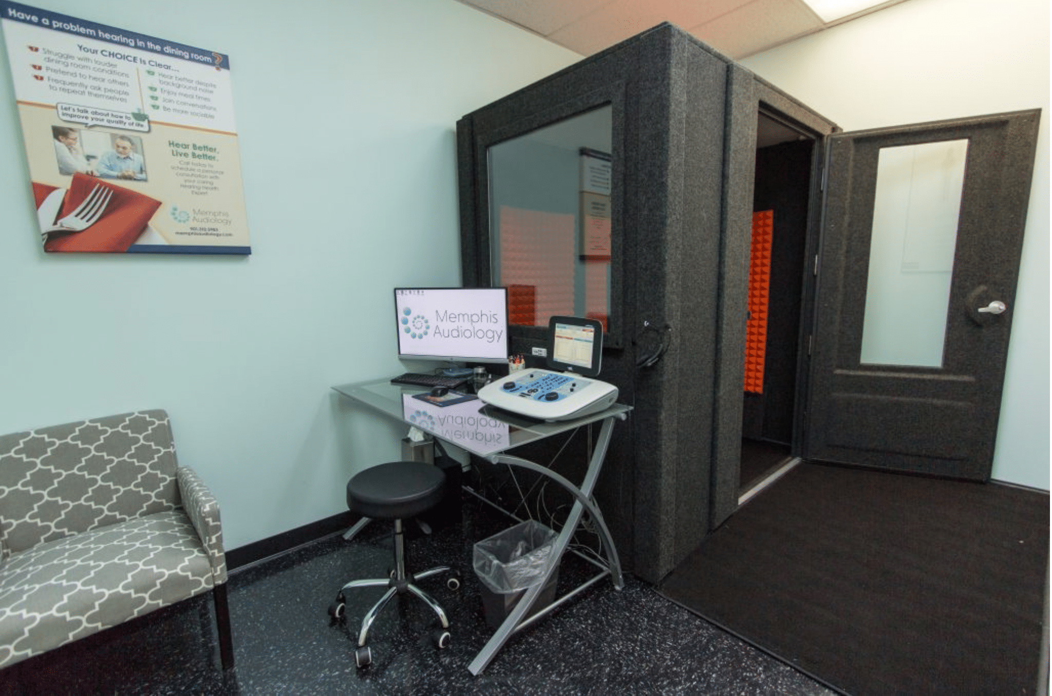 WhisperRoom audiometric booth at Memphis Audiology office, featuring Audiology testing equipment near the booth's window.