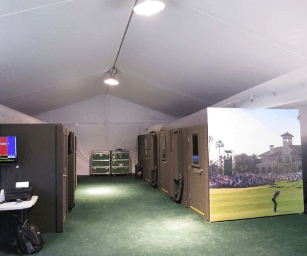 Five WhisperRoom broadcast booths and podcast booth solutions set up inside the international broadcast tent for the PGA Tour