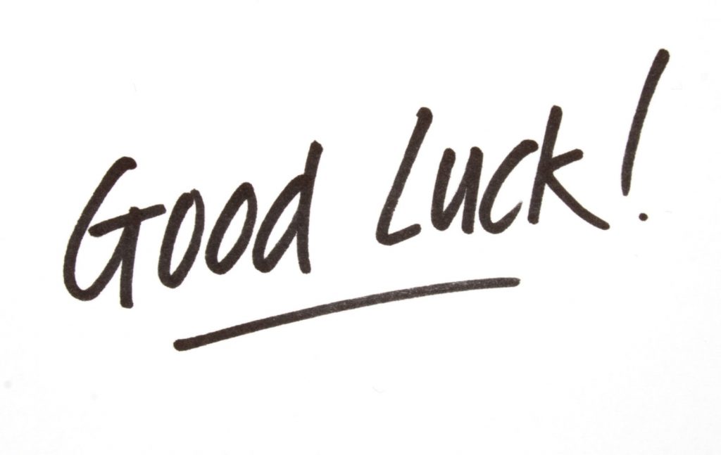 The phrase "good luck" handwritten with a marker