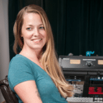 Mastering Engineer Kim Rosen sitting at her audio workstation