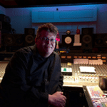 Mastering Engineer Harold LaRue next to his pro audio workstation inside of a recording studio