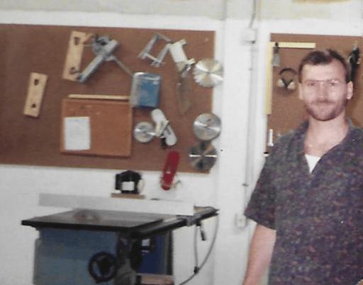 Founder and president of WhisperRoom standing in the company's wood shop