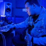 A man recording in his home studio