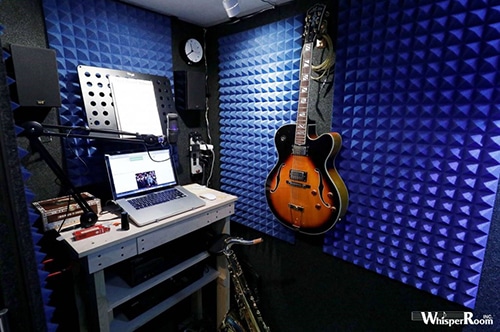 image of guitar and sax inside of a whisperroom booth