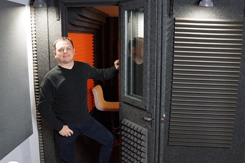 Voice actor Jorge Infante posing for a photo in his WhisperRoom