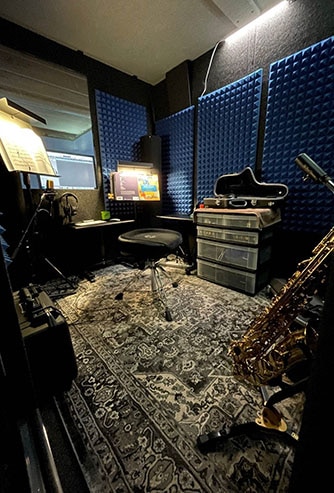 The interior of WhisperRoom's MDL 7296 S set up for saxophone practice.