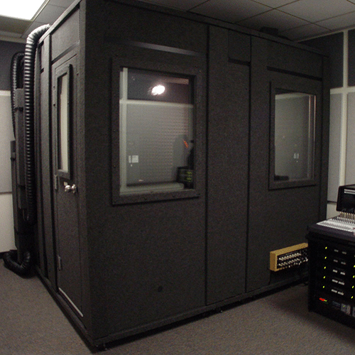 A WhisperRoom sound booth shown in an audio mixing room.