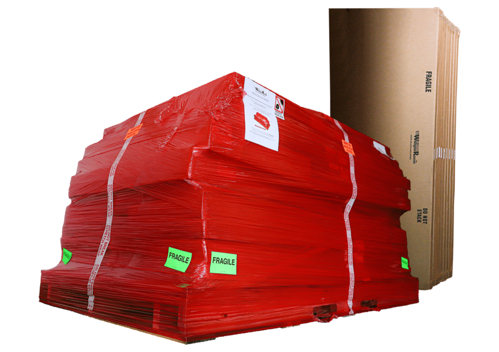 Components for a new WhisperRoom individually boxed for shipping and wrapped in red plastic on a pallet.