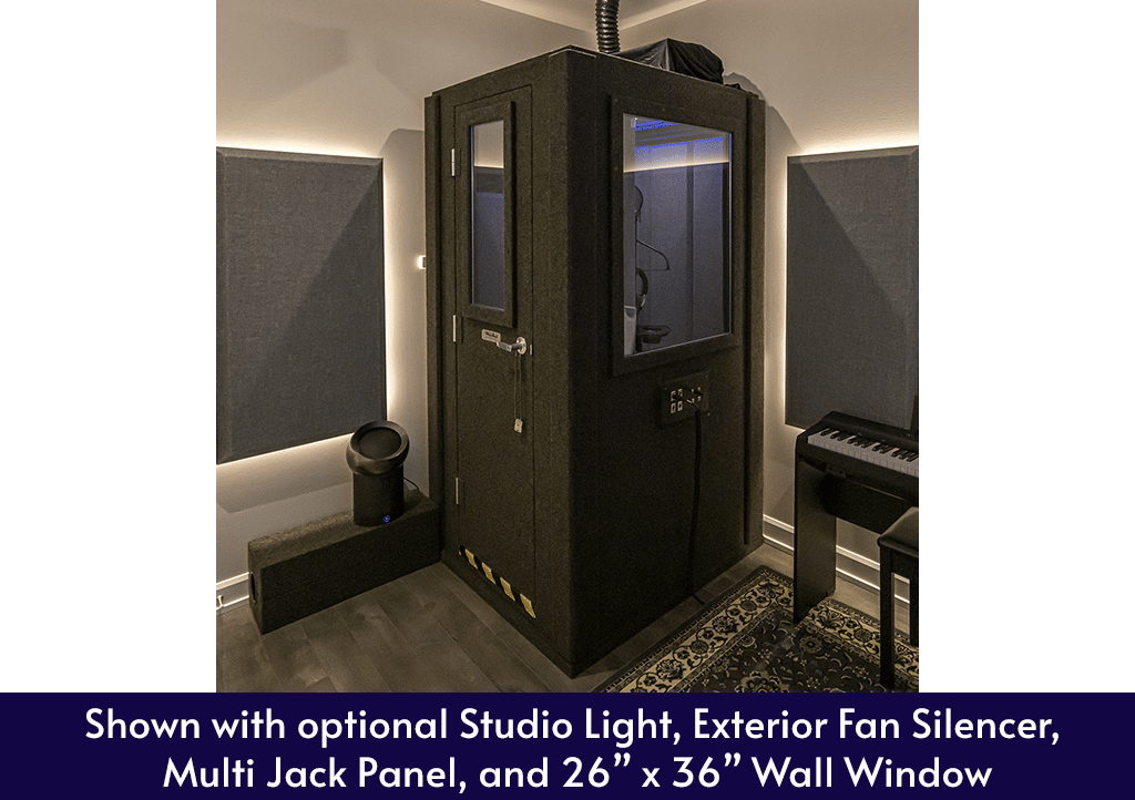 WhisperRoom MDL 4242 S shown inside of a home studio with a wall window, exterior fan silencer, and other various optional features.