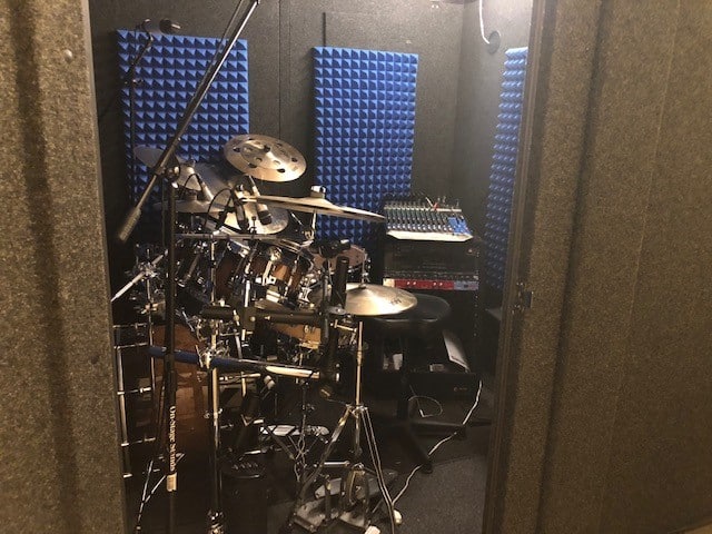 The interior of Kevin Thomason's WhisperRoom MDL 8484 with drums and a mixing board on the interior.